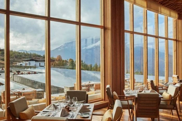 At 7,710 feet, Thimphu lies in a steep valley…